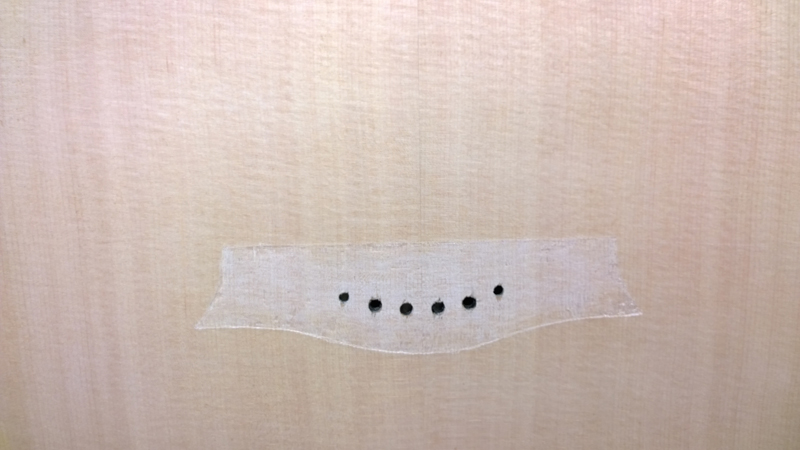 Finish removed from bridge footprint with scalpel and chisel