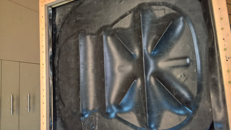 Back braces in vacuum box on 15-foot radius disk