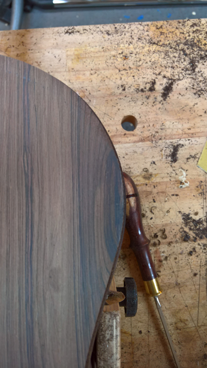 Chip-out repair on upper bout — patched and invisible