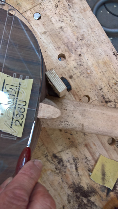 Hand-cutting binding channel at neck heel