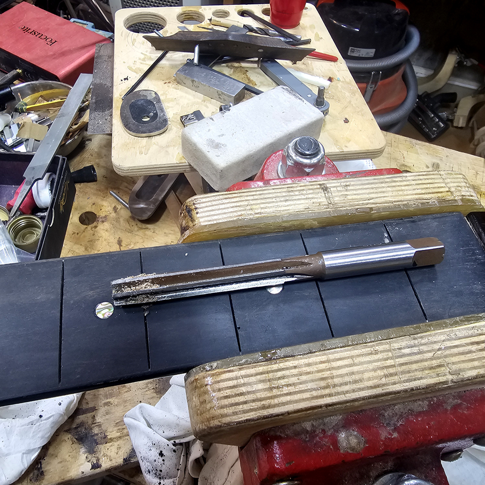 Reaming tuner holes clean of finish