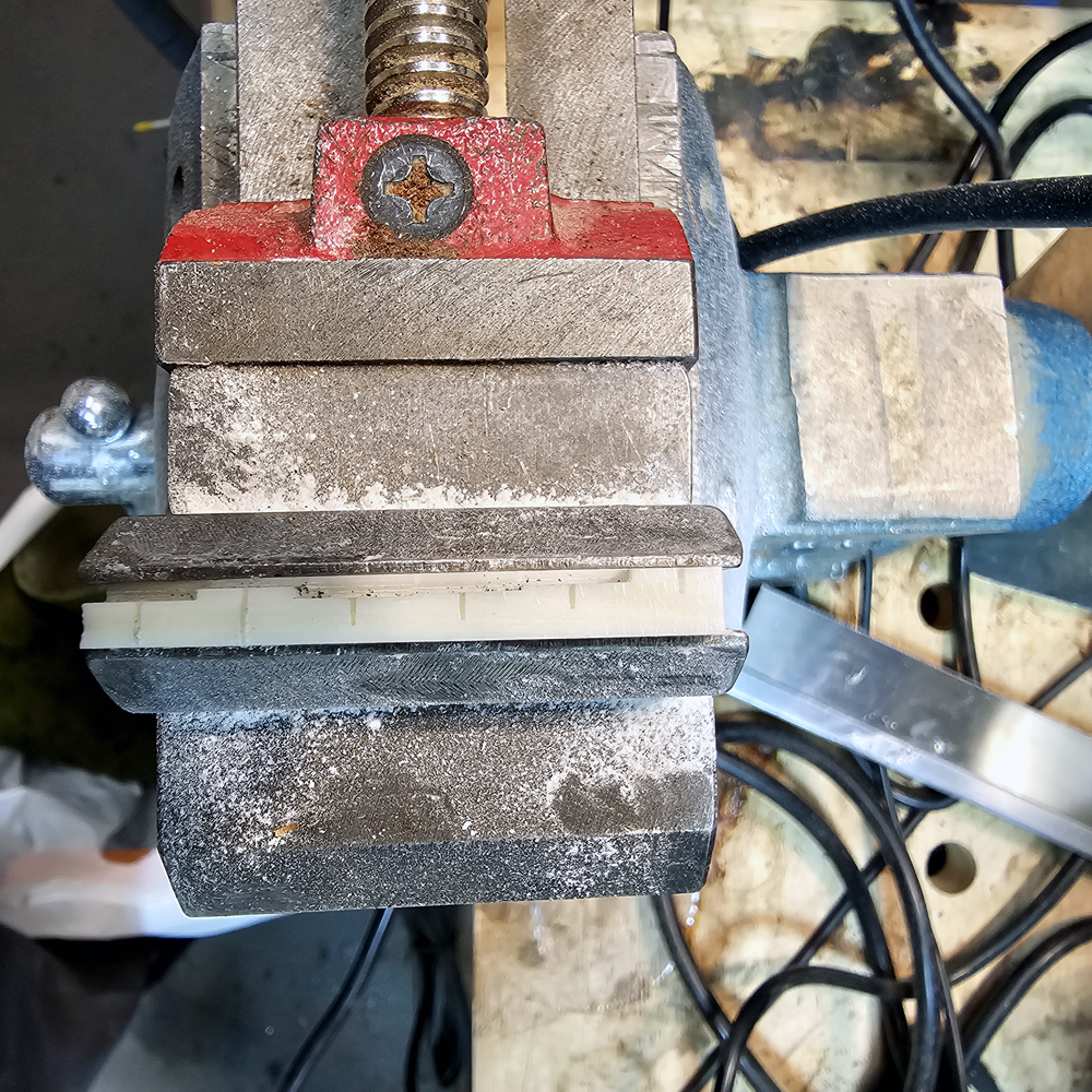 String slots deepened by hand with razor saw